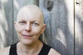 Outside portrait of balding woman with breast cancer Royalty Free Stock Photo